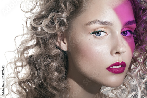 pretty girl with curly hair and pink shadow on the beauty face