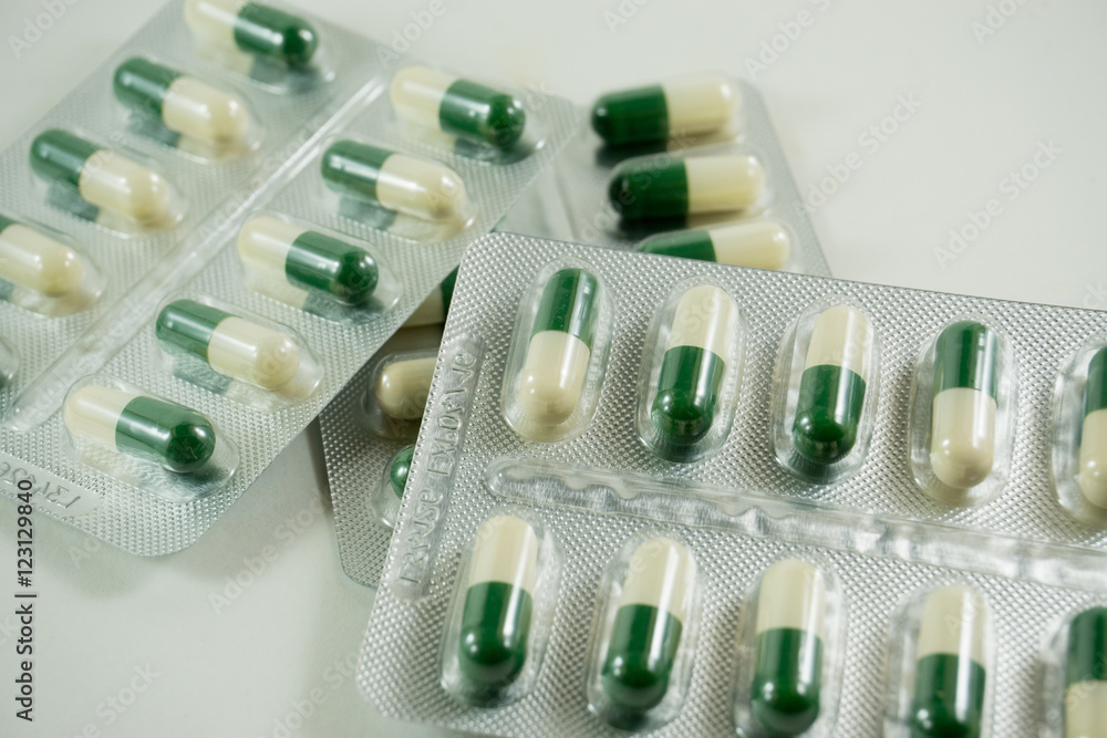 Packings of pills and capsules of medicines isolated on white background Packings of pills and capsules of medicines isolated on white background