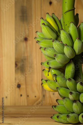 Fresh bananas on wooden background