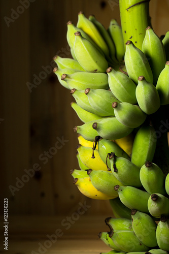 Fresh bananas on wooden background