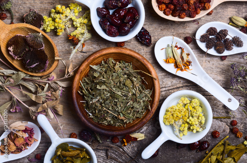 Foto Herbs in wooden spoon