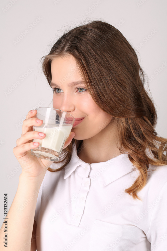 Model drinking milk. Close up. White background Model drinking milk. Close up. White background