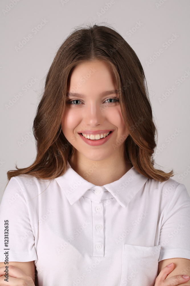 Model in T-shirt. Close up. White background Model in T-shirt. Close up. White background