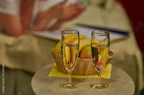Wallpaper Mural Two glasses of sparkling wine in hotel room with woman in backgr Torontodigital.ca