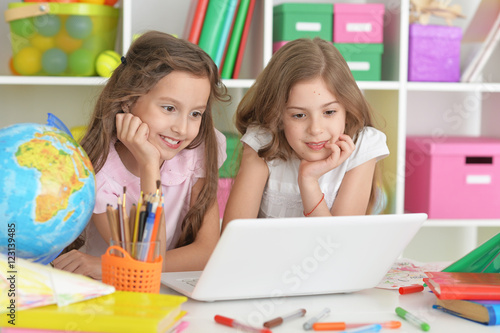beautiful little girls with laptop
