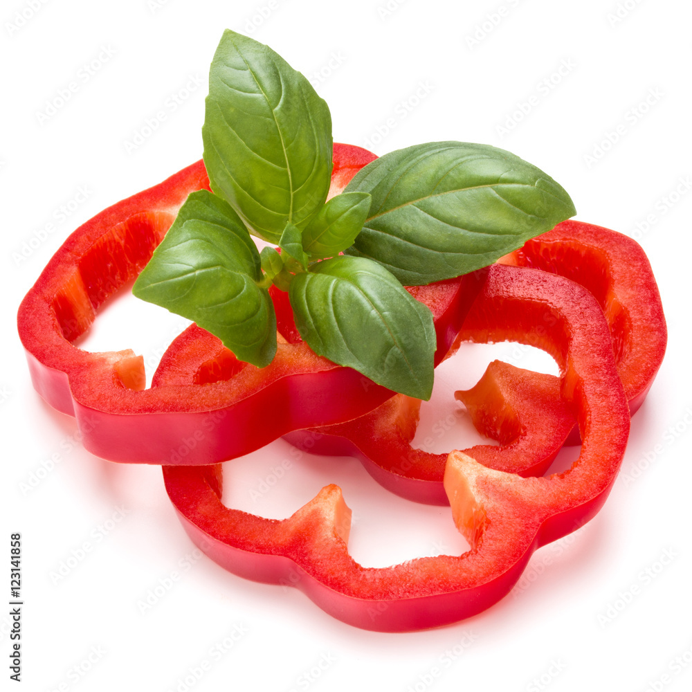 Red sweet bell pepper slices and basil leaves isolated on white Red sweet bell pepper slices and basil leaves isolated on white