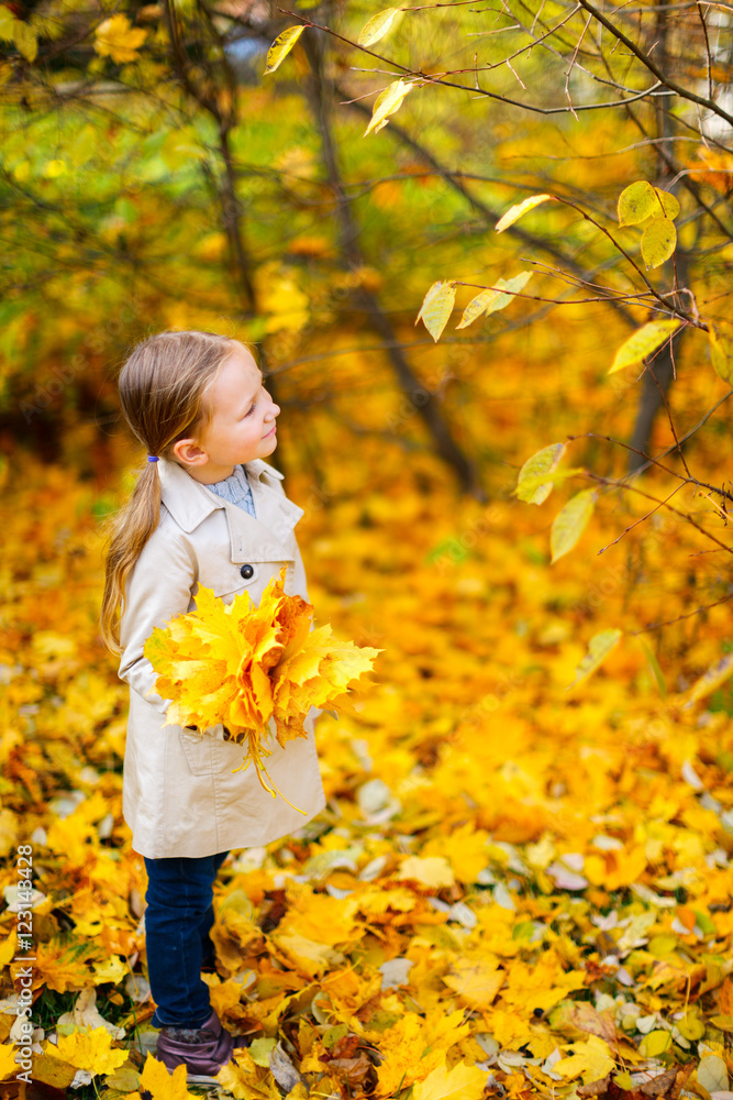 Little girl outdoors on autumn day Little girl outdoors on autumn day