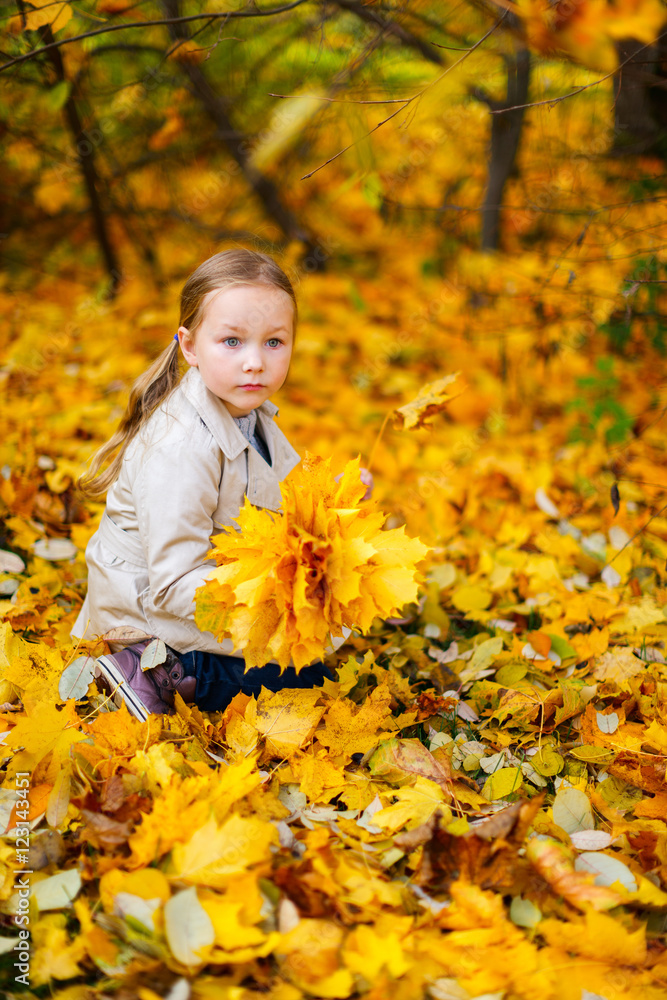 Little girl outdoors on autumn day Little girl outdoors on autumn day