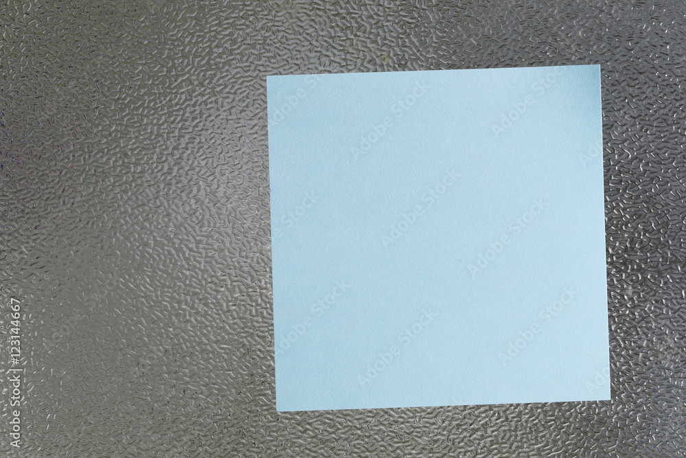 Fototapeta premium Blue of Note paper placed on glass floor.