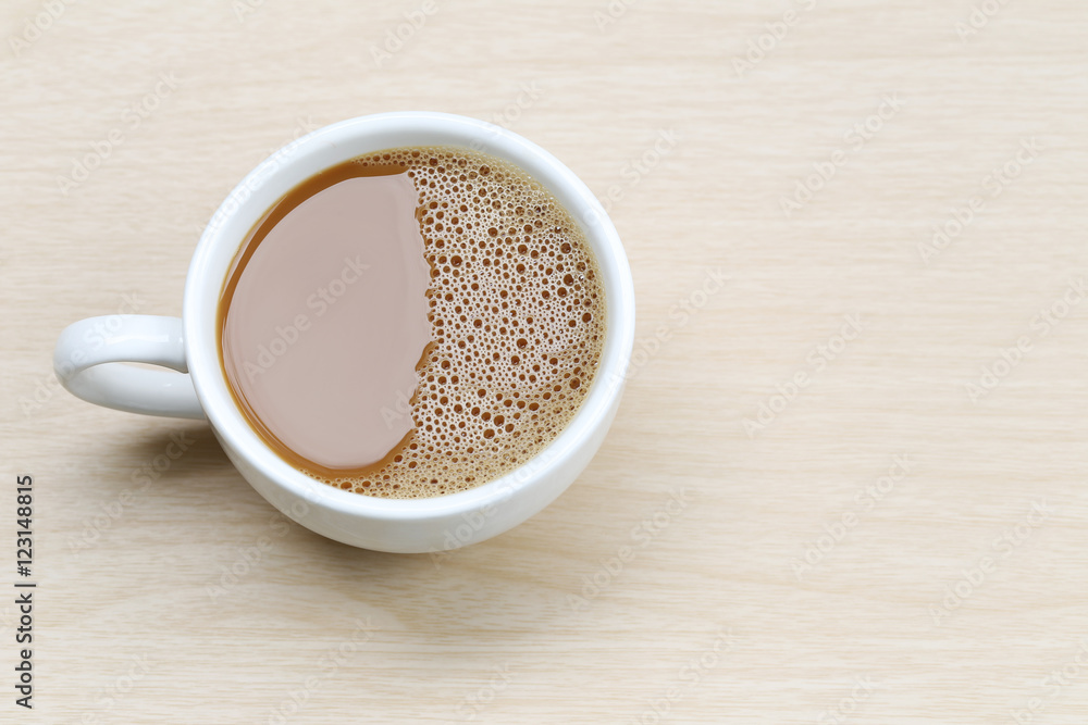 hot coffee in a white Coffee cup on wooden table. hot coffee in a white Coffee cup on wooden table.