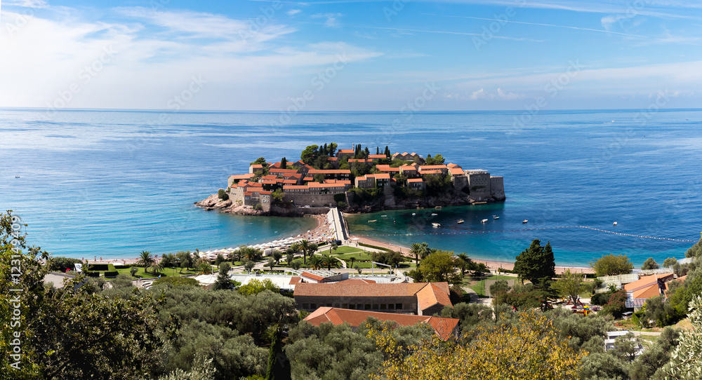 View of the island of Sveti Stefan on a sunny day, the end of September