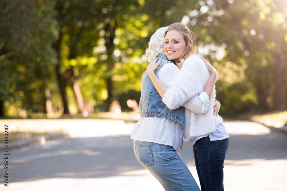 Young beautiful woman hugging her mother. Young beautiful woman hugging her mother.