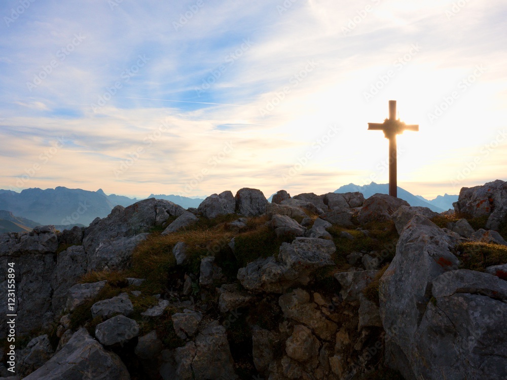 Iron cross at mountain top in alp. Monument to the dead climbers Iron cross at mountain top in alp. Monument to the dead climbers