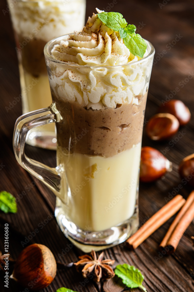 Vanilla pudding with chestnuts puree and whipped cream in a glass jar Vanilla pudding with chestnuts puree and whipped cream in a glass jar
