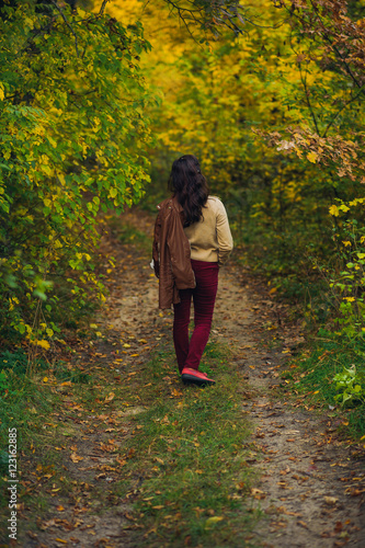woman walk in autumn forest © Mikhail Ulyannikov