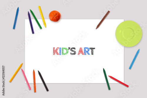 Kid's Art drawing Mockup, top view of blank paper sheet, placemat with crayons around photo