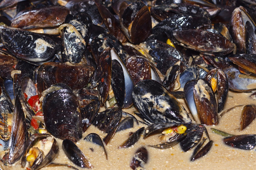 Mussels cooked in a sauce with spices Mussels cooked in a sauce with spices
