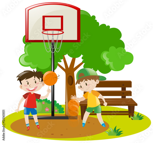 Boys playing basketball in the park