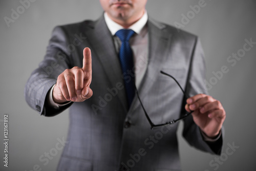Businessman pressing buttons in business concept