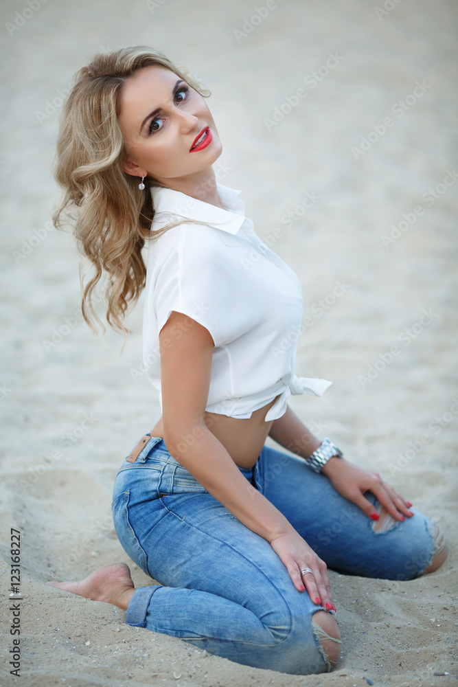 Beautiful blonde woman smiling portrait outdoors