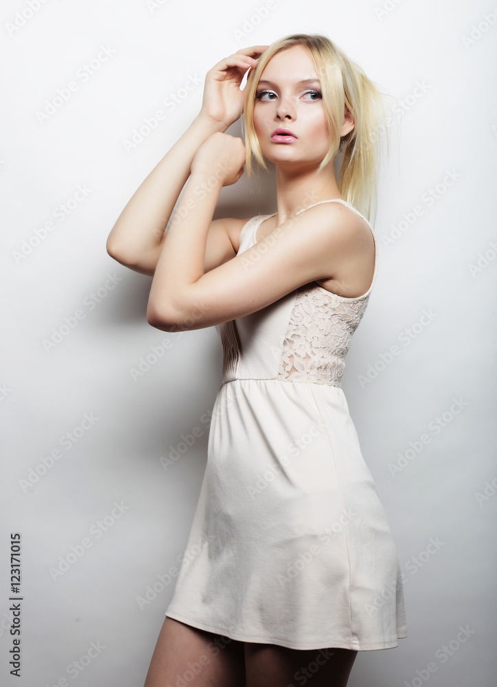 Fototapeta premium young magnificent woman in white dress.