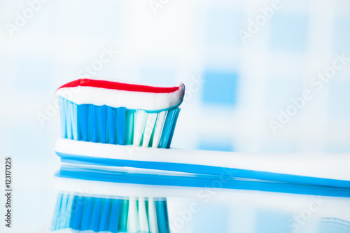 toothbrush with red stripe toothpaste