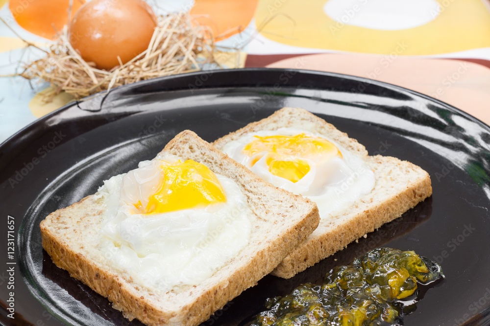 Fototapeta premium Egg bread and Orange jam breakfast.