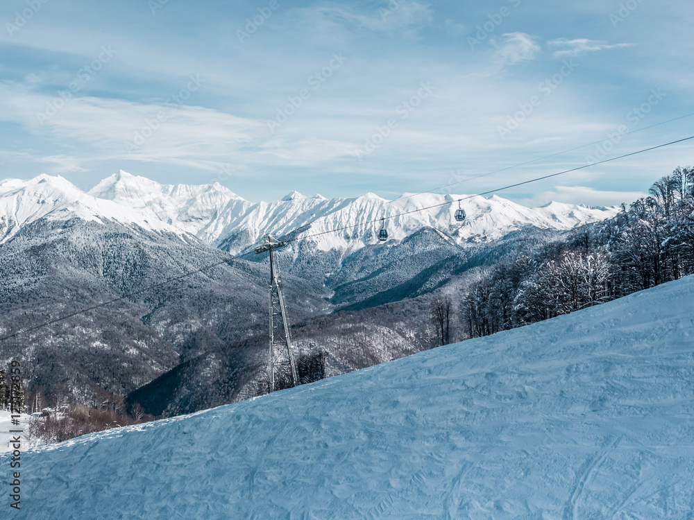 Fototapeta premium Winter landscape in mountains with cableway