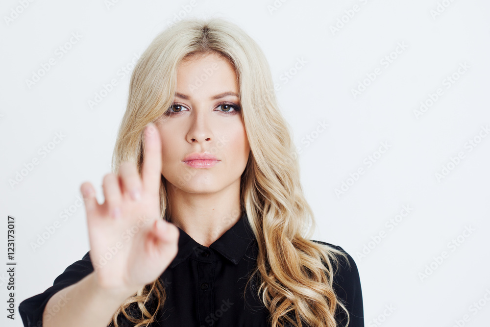Confident business lady, touching finger to screen, digital with , place for your text or design. Focus on face Confident business lady, touching finger to screen, digital with , place for your text or design. Focus on face