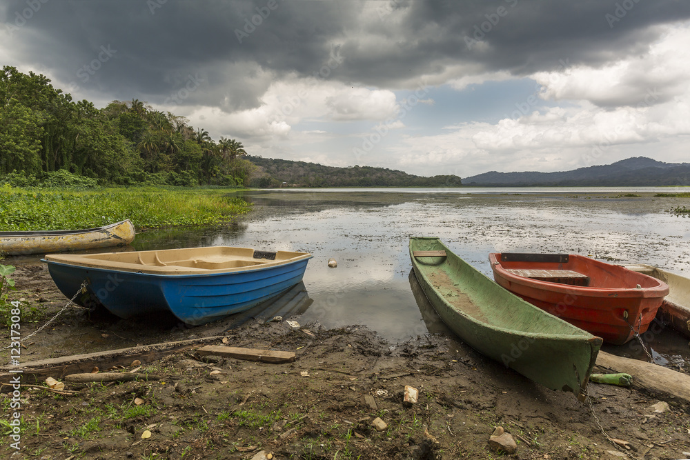 Dugout Canoe and Other Boats at River's Edge - Gamboa, Panama Dugout Canoe and Other Boats at River's Edge - Gamboa, Panama