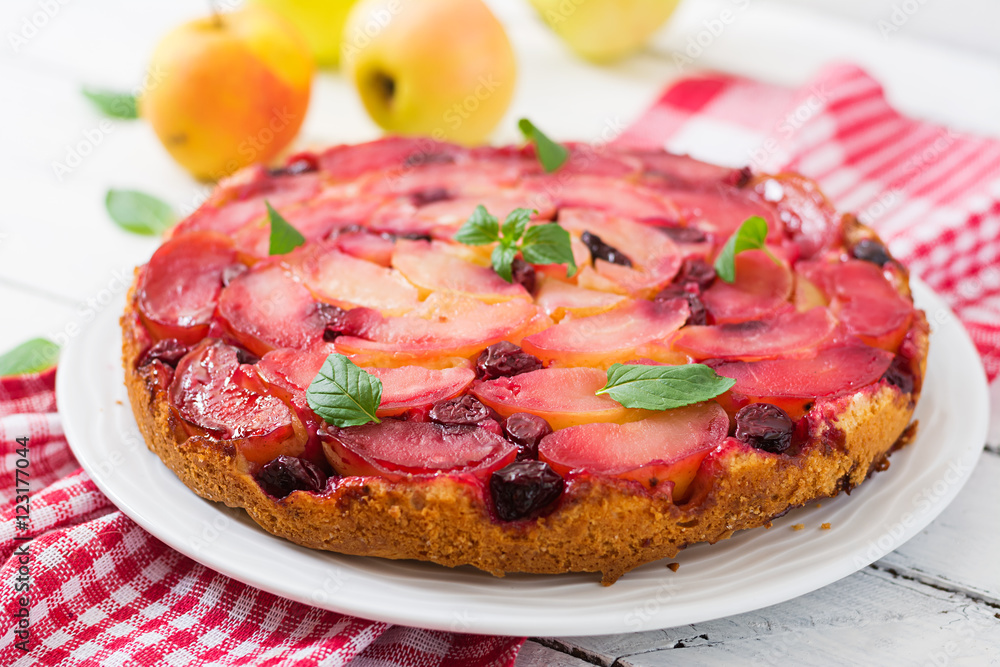 Delicate biscuit cake with apples and cherries. Delicate biscuit cake with apples and cherries.