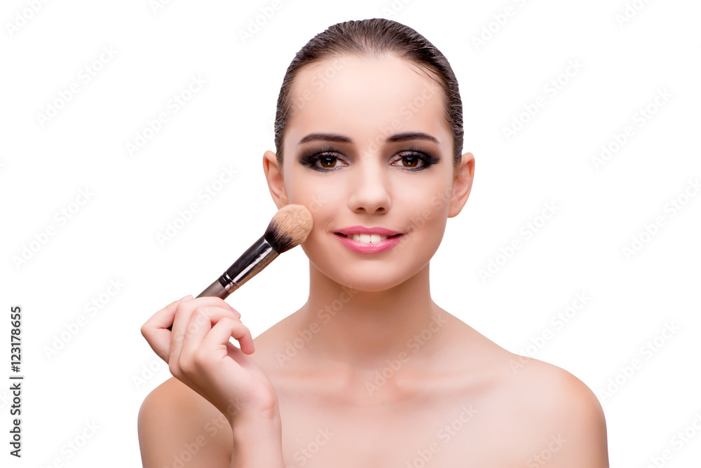 Young woman applying make up isolated on white Young woman applying make up isolated on white