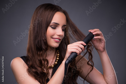 Beautiful woman applying make-up in fashion concept 