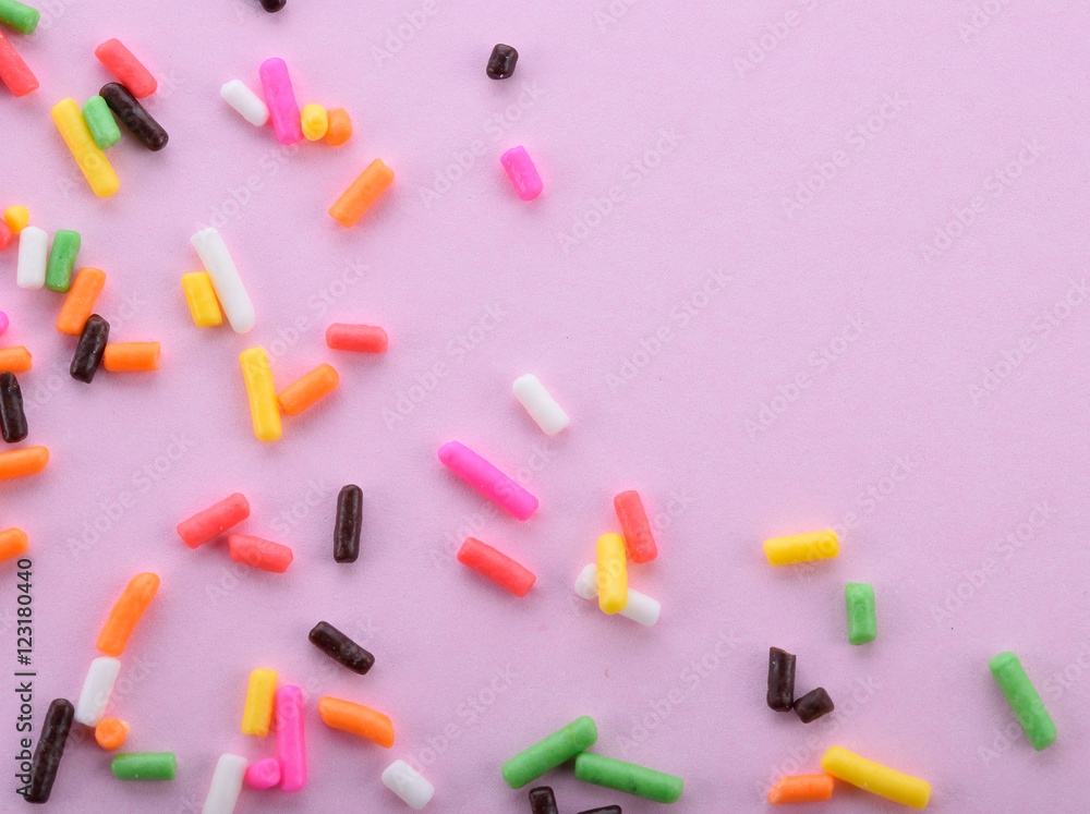 Macro sprinkle on a pink background Macro sprinkle on a pink background
