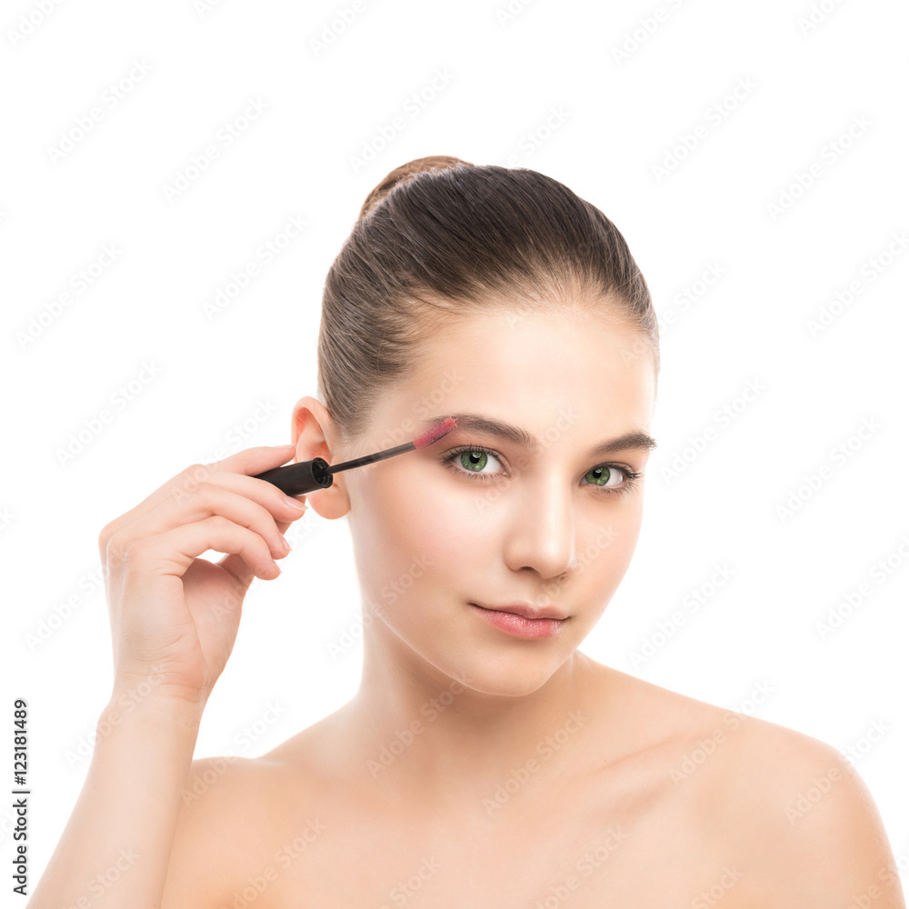 Eye make up apply. Mascara applying closeup, long lashes. Mascara brush. Portrait of beautiful young brunette woman with perfect fresh clean face skin. Eyelashes extensions. Make-up for green eyes Eye make up apply. Mascara applying closeup, long lashes. Mascara brush. Portrait of beautiful young brunette woman with perfect fresh clean face skin. Eyelashes extensions. Make-up for green eyes