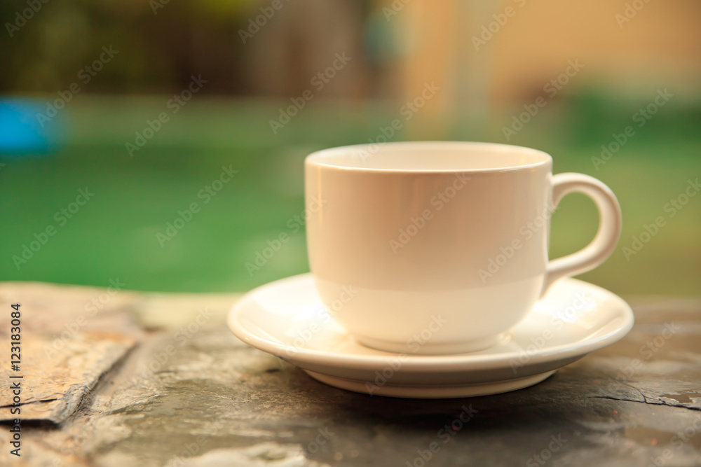 Cup of coffee on a wooden table.