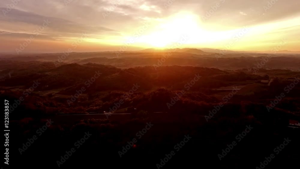 Flying over rural hills in sunset Flying over rural hills in sunset