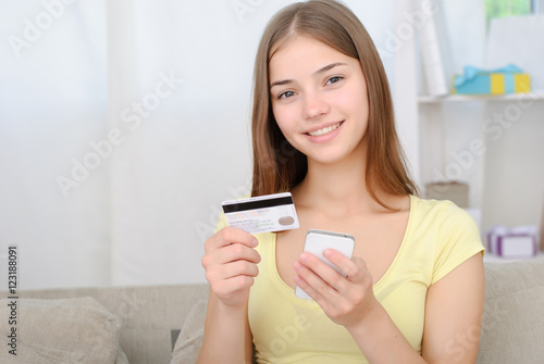 beautiful girl with credit card. Online shopping concept.