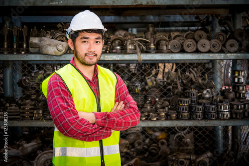 Portrait of Asian worker in Factory warehouse car parts.