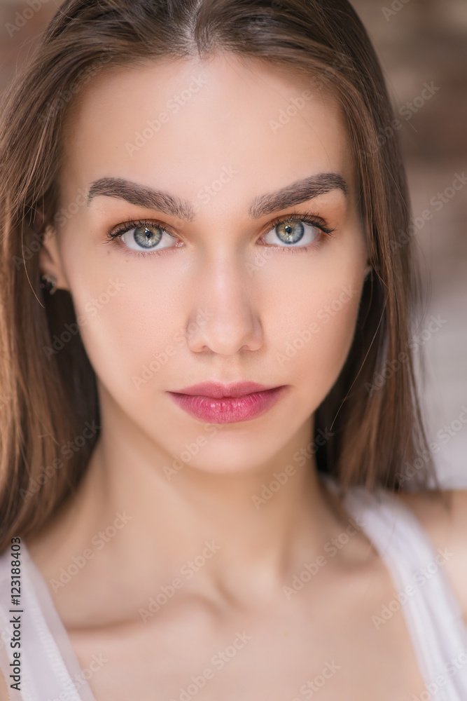 Obraz premium Portrait of beautiful young woman with blue eyes.