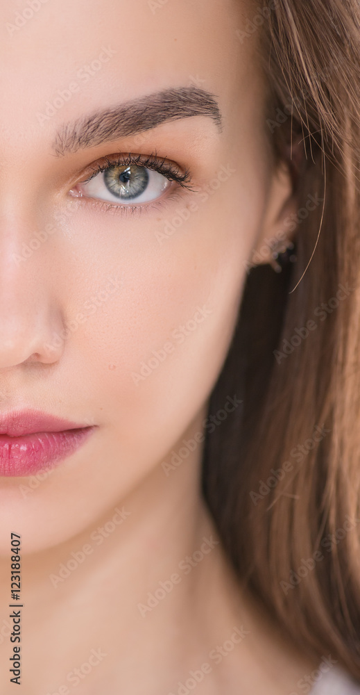 Outdoors portrait of beautiful young woman with blue eyes. Outdoors portrait of beautiful young woman with blue eyes.