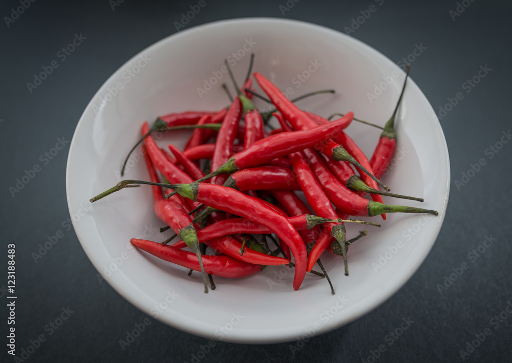 Red hot chili pepper on a dark background. Red hot chili pepper on a dark background.