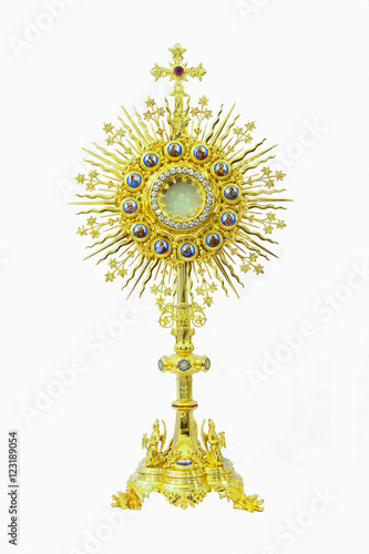 Old gold monstrance Jesus body on white background