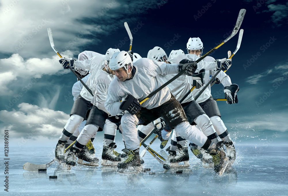 Fototapeta premium Ice hockey player in action outdoor around mountains