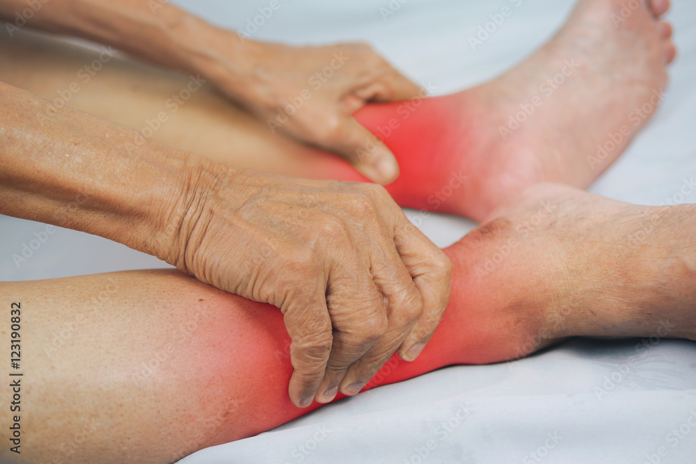 senior man hand holding he healthy foot and massaging ankle in p senior man hand holding he healthy foot and massaging ankle in p