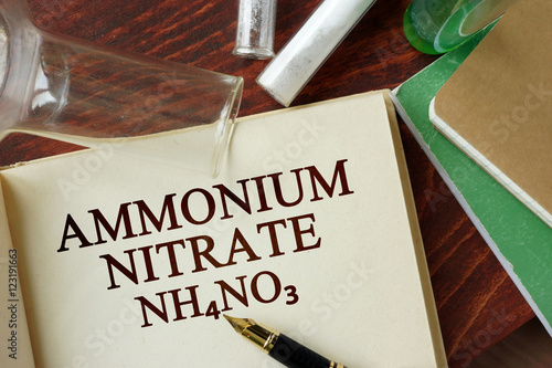 Word ammonium nitrate written on a page. Chemistry concept. photo