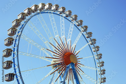 Big ferris wheel over blue sky