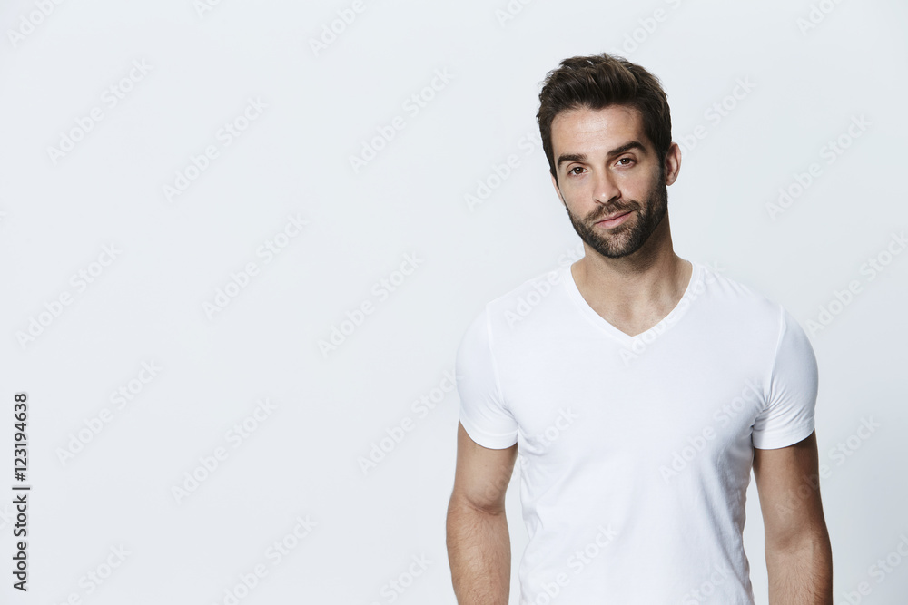 Man in white t-shirt in studio, portrait Man in white t-shirt in studio, portrait