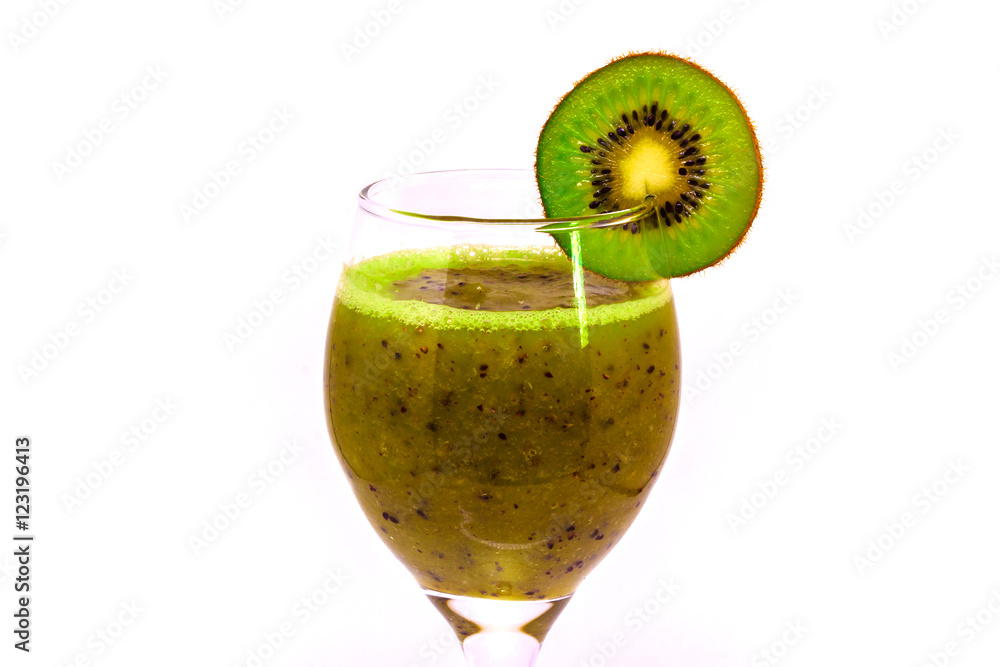 Healthy fresh kiwi smoothie in wine glass on a white background