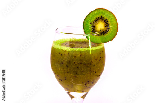 Obraz na płótnie Healthy fresh kiwi smoothie in wine glass on a white background w salonie